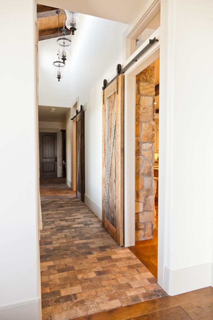 BrickFloorsAndBarnStyleSlidingDoorsInThisHallway BrickFloorsAndBarnStyleSlidingDoorsInThisHallway