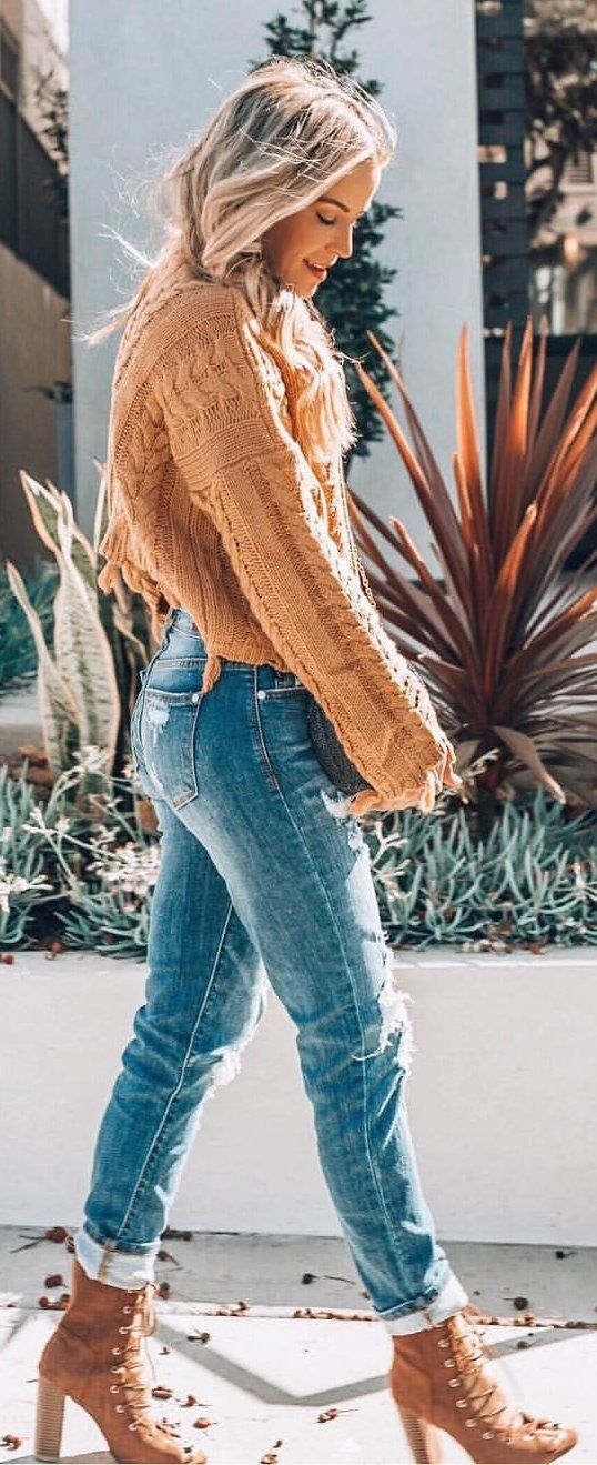 knitted beige jacket and blue jeans