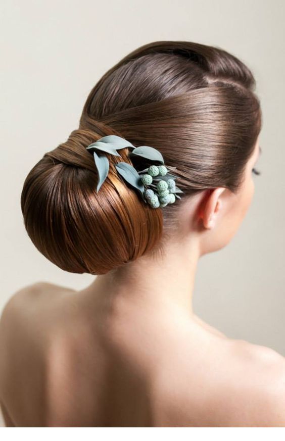 Low bun with a flower