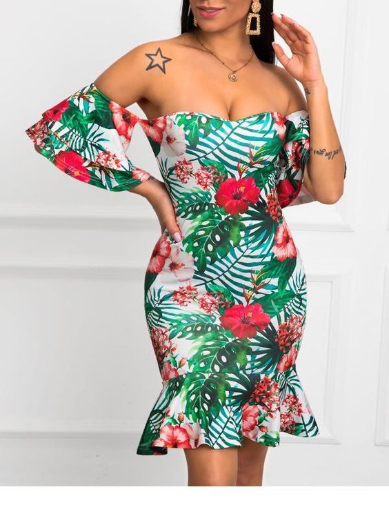 Floral dress, tattoos and big earrings
