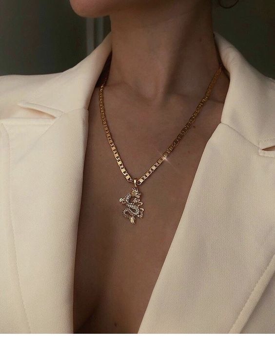 Nice white blazer with a gold necklace