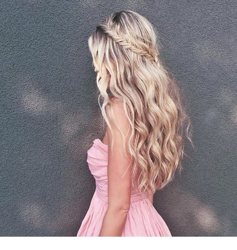 Curly blonde hair and a fishtail