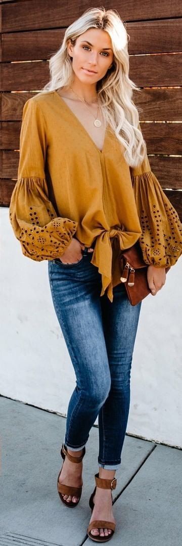 brown V-neck long-sleeved blouse and blue denim jeans #spring #outfits