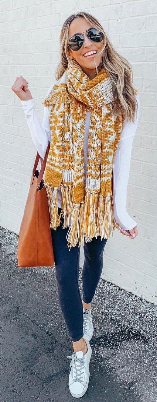 brown and white scarf with fringe