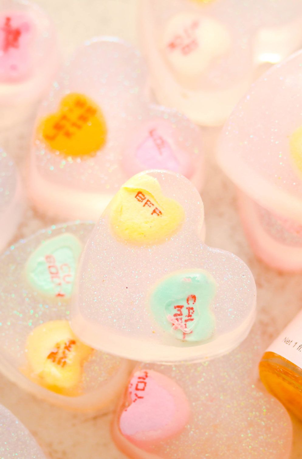 Make this easy valentines day conversation hearts soap DIY made with real candy! It makes the perfect gift! Make this easy valentines day conversation hearts soap DIY made with real candy! It makes the perfect gift!