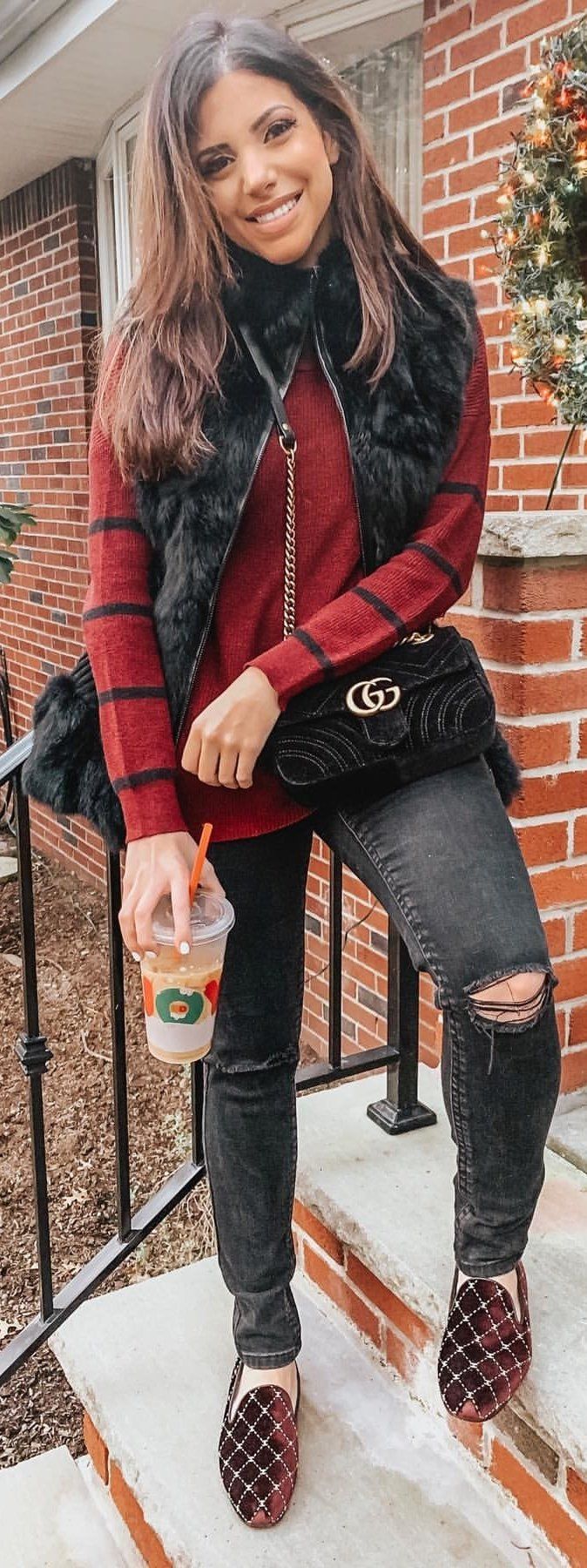 red and black striped long-sleeved top and distressed black jeans red and black striped long-sleeved top and distressed black jeans