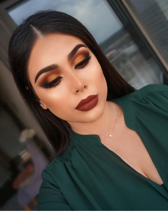 Brown makeup and green shirt