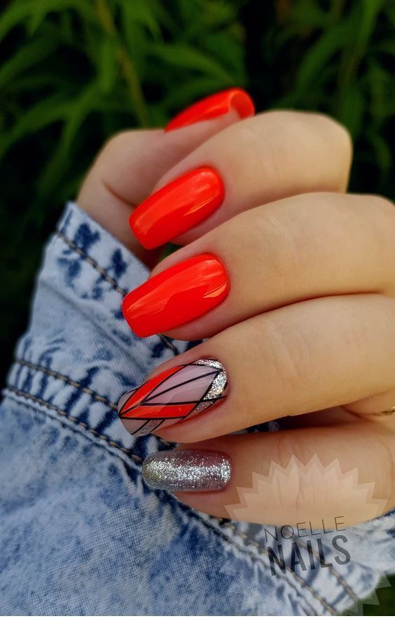 Bright red gel nails with geometric print