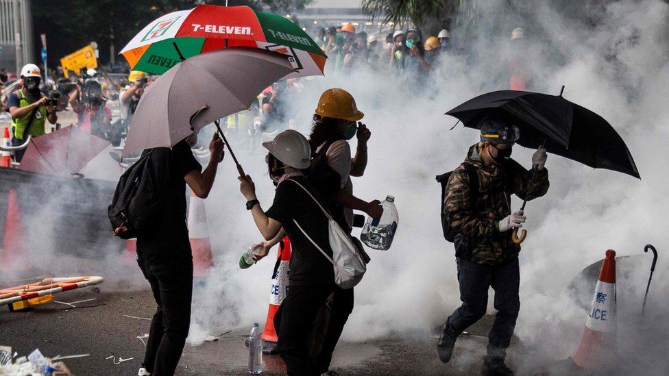 Police took action as opponents of a draft extradition law tried to storm government offices. Police took action as opponents of a draft extradition law tried to storm government offices.