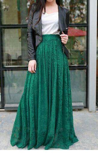 White top, long green skirt and black leather jacket