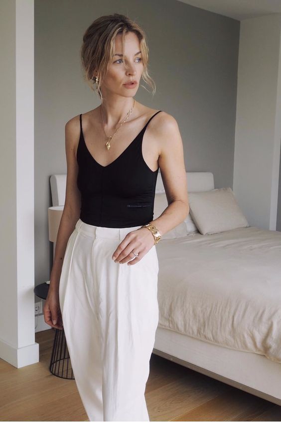 Nice black top and white pants with gold accessories Nice black top and white pants with gold accessories