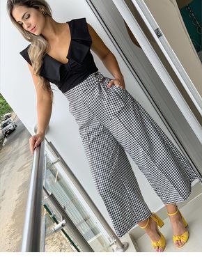 Black top, plaid skirt pants and yellow sandals Black top, plaid skirt pants and yellow sandals