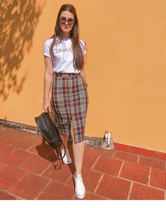 White t-shirt and plaid skirt