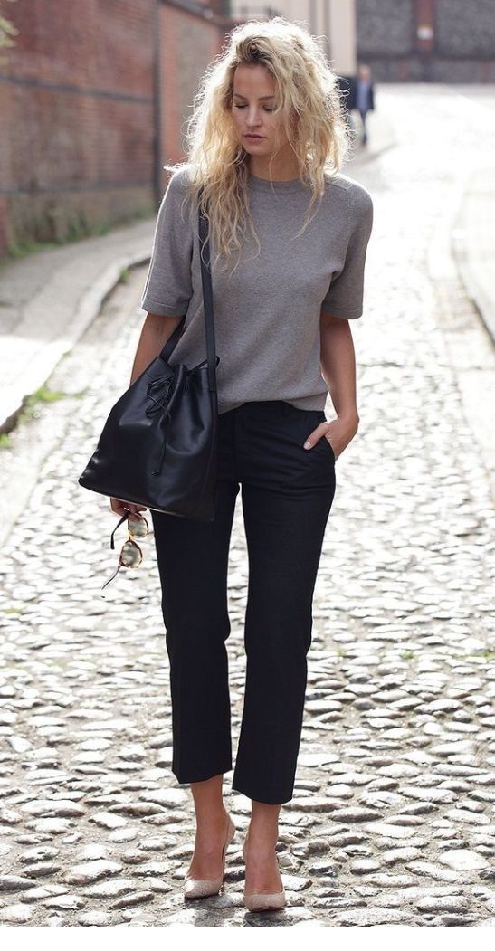 Grey top, black pants and messy hair Grey top, black pants and messy hair