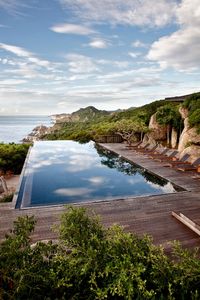 Experience the luxury, relaxation and unbelievable views at the Aman Resorts in Vinh Hy Bay, #Vietnam! Observe how the clouds reflect in the gorgeous pool as you overlook the mountains and enjoy a leisurely vacation like no other!