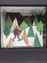 Using card cut-outs to create a fabulous shop window. This could also work as a cost-effective craft fair display. #Smallbusinessideas #retailideas #Christmasretailstandideas #Christmas #retail #craftfair #stand #inspiration