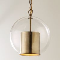 This pendant works well in traditional and modern spaces. The hand-blown clear glass round globe creates sleek modern style while the antique brass or polished nickel hardware provide traditional elements. A perfect pendant over your wood bar that complements old brass foot rails or your polished nickel drawer pulls. Bubbles in the glass are part of its hand-blown nature. Cap and globe can be disassembled to clean inside glass.