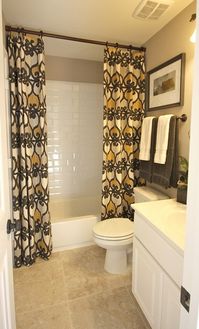 Bathroom...Use regular curtains and take rod to the ceiling - so easy with huge impact!