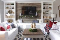Christmas living room with bookcases converted into built-ins *Love the bench between the bookshelves*