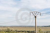 power-line-field-cloudy-sky-romania