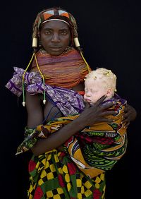 Albino baby girl and her Mwila mother - Angola flickr.com
