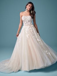 Chalk it up to your sunny disposition-the beads are practically blooming off this floral lace A-line wedding dress in 3D motifs and summer-ready illusion. Organza lined lace bodice embellished with beaded three-dimensional lace motifs Beaded three-dimensional lace motifs trail into the skirt Straight illusion neckline with sweetheart base Illusion lace back Covered button over zipper and inner corselette closure Detachable velvet ribbon belt sold separately