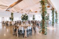 Gold and White Wedding | Doorway and Swooping Ceiling Draping | Columns Decorated with Twinkle Lights and Greenery | Tall White and Green Centerpieces | Gold Knotted Chair Ties | Crisp White Linens | LB Floral | Marblegate Farm Wedding | Knoxville Wedding | Fall Lakeside Wedding | Glam Wedding | Tara Kneiser Photography | Absolute Wedding Perfection