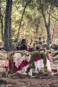 Red Riding Hood Noir Wedding Inspiration Shoot // dark, woodsy table decor with hand lettered details // photo: Nerinna Studios