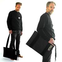 Vegan leather bag oversize with long strap in grosgrain, twin handles, long zip and 2 internal pockets. Every bag is an unique piece 100% Made in Italy, hand sewn by our artisans with high quality cruelty-free materials. Measurements: 30 x 40 cm Material: SnapPap | 60% Cellulose 40% Latex Color: Black Garment Care: Do not wash