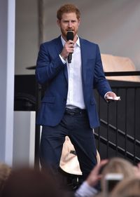 Prince Harry speaks as they host a tea party in the grounds of Buckingham Palace to honour the children of those who have died serving in the armed forces on May 13, 2017 in London, England.