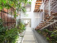 The breathable steel panels provide a good foil for the greenery inside the house. Image courtesy, Lijo Reny Architects