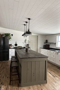 A farmhouse kitchen remodel in a double wide mobile home. I built this large farmhouse island with seating as part of our remodeling renovation. See the details in the post.