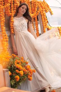 Halter neck wedding dress with detailed lace and a soft tulle skirt. *Only Available Off-the-Rack, No Reorders*