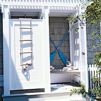 Room-saving Storage Ideas for Outdoor Showers < Fresh-Air Outdoor Bath Showers for Beach Houses - Coastal Living