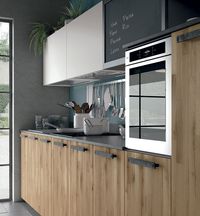 Natural aged oak with parquet effect | Matt absolute white | Aluminium with oxidized urban finish black slate laminate panel | Doors and bookcase: matt bistro | Worktop: Fenix laminate | Plinth: black