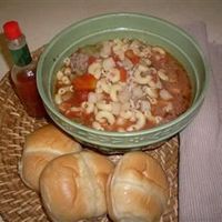 This recipe is a favorite in my family. My grandma says it was a soup of the Depression era that evolved over time. As each of us made it for our families, we added to it. It is simple, affordable, and quite good. Add pearl onions and sliced zucchini, if desired.