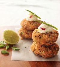 Salmon Cakes with Spicy Lime Yogurt Dip Recipe Appetizers, Main Dishes, Lunch with salmon fillets, extra-virgin olive oil, salt, pepper, fresh breadcrumbs, panko breadcrumbs, egg whites, spring onions, small potatoes, ginger, sesame oil, sesame seeds, lime zest, parsley, vegetable oil, greek yogurt, soft goat cheese, lime, red chili peppers, spring onions, salt, pepper