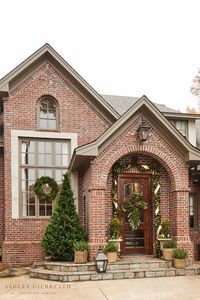 ASHLEY GILBREATH INTERIOR DESIGN: The doorsteps of a traditional, Southern home decorated for the holiday season. We love simple and meaningful exterior Christmas decor.