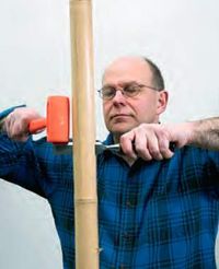Splitting tonkin cane with a bench chisel
