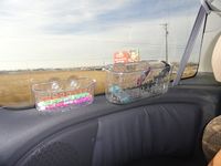 Use shower baskets to stick to the window on road trips to hold markers and such.....great idea