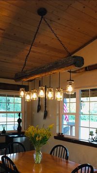 "We hand craft this chandelier using a one of a kind vintage reclaimed wood beam from our 1880's Homestead Log House (pictures in photos) located on our NW Montana Ranch. This is a solid wood beam and not a synthetic material. Many many moons ago this reclaimed beam was hand hewn when the homestead house was painstakingly built by hand in the late 1800's. It is truly a unique and authentic treasure. Not one of our reclaimed items are made from pallet wood or other low quality wood. This is the r