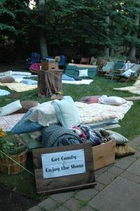 Host a movie night on your lawn and provide your guests with comfy blankets and pillows to relax and lounge on.