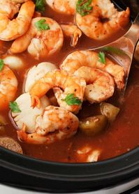 A delicious seafood recipe cooked in a tomato-based broth with potatoes. This slow cooker seafood stew is comforting and is an easy-to-make dinner idea!