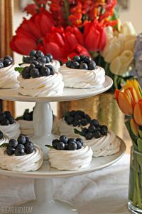 Blueberry Pavlovas - mini meringues with whipped cream and fresh blueberries. A perfect spring dessert! | From SugarHero.com
