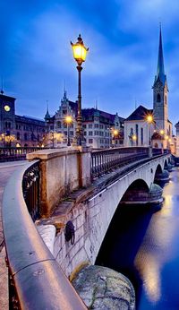 Beautiful View on Fraumunster Church and Church of St. Peter at night, Zurich, Switzerland | See why Switzerland is the Country where Splendor seems to be Endless