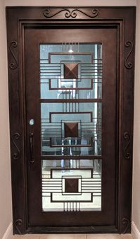 Dance to the beat of your own drum? Let us help you choose (or design!) a door that represents your own unique style, like this custom made contemporary style iron beauty. remodel. custom home. iron doors. dream home. entryway. front door. entry door. wrought iron door. contemporary design. custom home builders. luxury homes.
