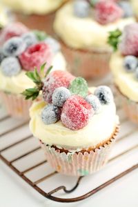 These Frosted Berry Cupcakes with an Orange Mascarpone Buttercream feature a fluffy orange cake topped with a luscious frosting, and sugared fruit. They are a beautiful cupcake full of bright flavours.
