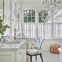 Nina (Nash) Long on Instagram: "It’s Monday, let the sunshine in! Beautiful original Neel Reid sleeping porch turned natural light filled Master Bathroom. Interiors @doneasterling + @ninamarienash, Architecture @cbrandoningram, 📷: @emilyfollowillphotographer."