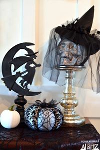 Easy and so cute! Dollar store skull and witches hat, some black netting or mesh... Stocking pulled over a decorative white pumpkin.. Love it.