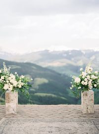 This couple celebrated their outdoor wedding in Vail, Colorado - With all white bridesmaid dresses, a beautiful destination venue, green and white wedding details and perfect winter wedding decor! Click to see inspiration for your winter wedding or outdoor Colorado wedding. #Wedding #Outdoor #Vail #Colorado #WeddingPlanning #Winter #Green #White #AllWhite #Destination | Martha Stewart Weddings